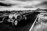 1930s ratrod on the road heading into the horizon