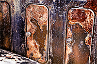 Three rusty hood vents in a row of an old 1930s car 